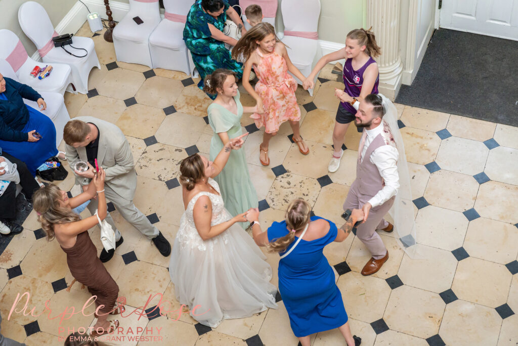 Aerial photo of wedding guests dancing at a wedding at Chicheley Hall in Milton Keynes