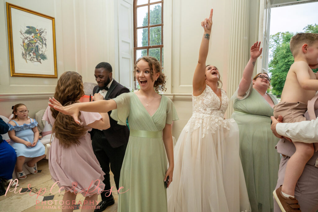 Wedding guests dancing at a wedding at Chicheley Hall in Milton Keynes