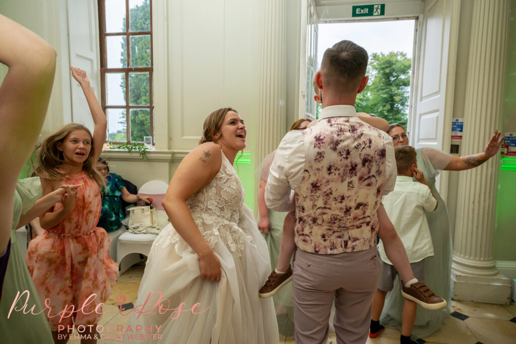 Wedding guests dancing at a wedding at Chicheley Hall in Milton Keynes