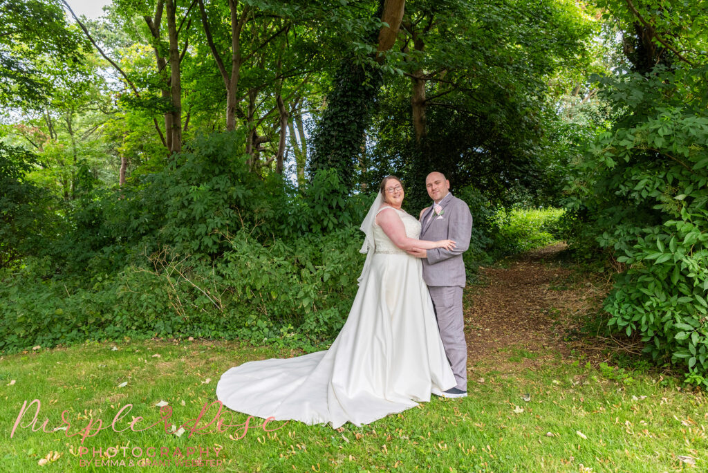 Bride and groom in the grounds of their wedding venue in Northampton