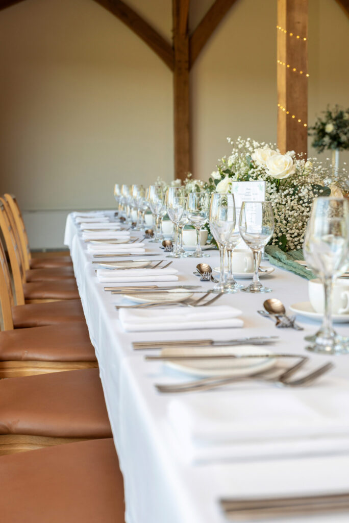 Photo of wedding top table set up and ready for the wedding breakfast at Dodford Manor